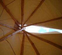 Looking up through the smoke flaps that allow the smoke from the fire to escape;