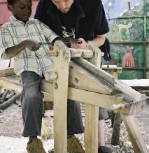 Using a shave horse and draw-knife to roughly shape a chair leg