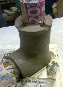 building a clay rocket stove, moulded around 2 pipes at right angles, which will be removed later