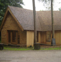 a building at Ecclesall Woods Sawmill in Sheffield with wooden shingles on the roof and walls