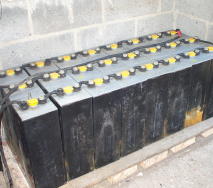 A collection of 600 amp-hour, 2-volt cells wired in series (part of a 48-volt battery pack);