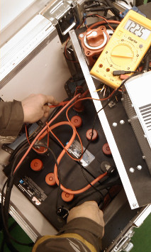 testing the voltage of batteries with a voltmeter