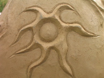 plastering detail on a cob earth oven