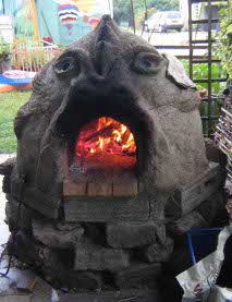 'Dragon' earth oven fired up and ready to go