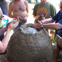 Building up an oven around a dome of sand
