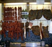 cold smoked meats and sausages of various kinds, in a shop in northern Italy