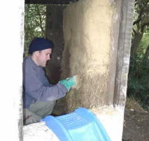 Lime rendering a straw-bale children's play house