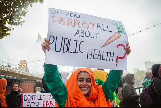 A participant at the Good Food March 2018 with their placard via www.goodfoodmarch.org