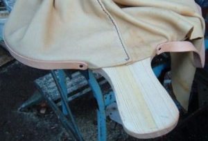 Attaching the leather at the handles end first