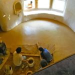 Laying an adobe earthen floor