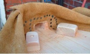 Blocks to support top board to stop excess stress on hinge