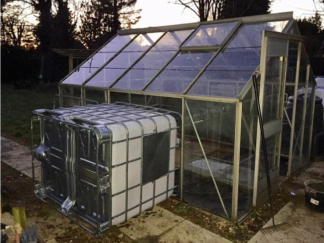 Some removal of glazing was necessary when building the aquaponics greenhouse