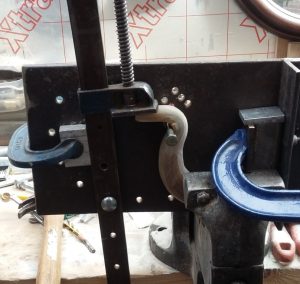 A jig modified to make turning the nose of the horn an easier process