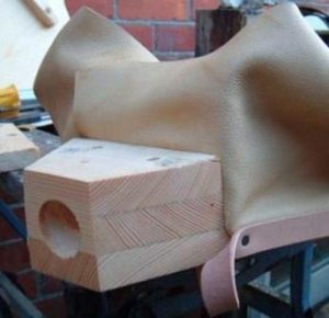 Note that the leather does not stop at the top of the nozzle block