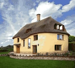 Low-impact building using cob and thatch building9