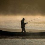 Charlie Loram of The Old Way fishing from a boat