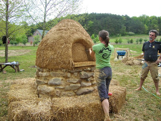 Cutting the door in the cob oven